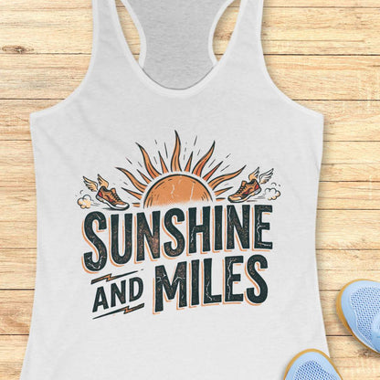 white tank top with 'Sunshine and Miles' graphic on a wooden surface