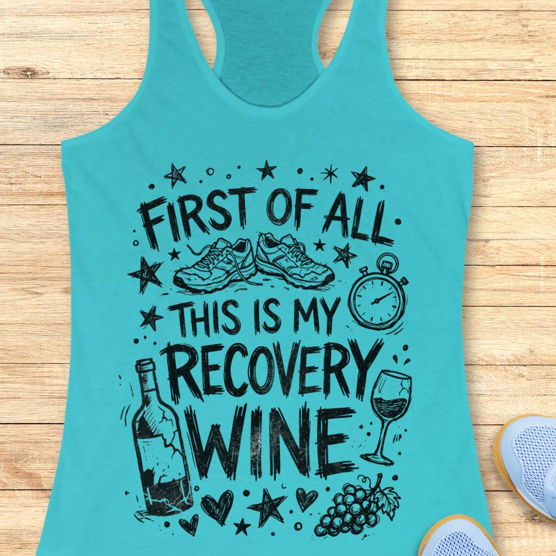 Turquoise tank top with humorous text 'first of all, this is my recovery wine',  and graphics on a wooden surface