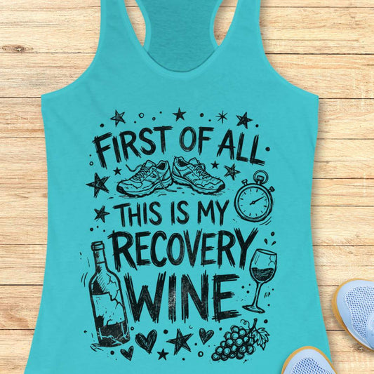 Turquoise tank top with humorous text 'first of all, this is my recovery wine',  and graphics on a wooden surface