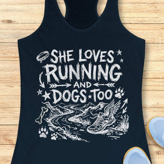 navy tank top with white text 'she loves running and dogs too', and graphics on a wooden surface