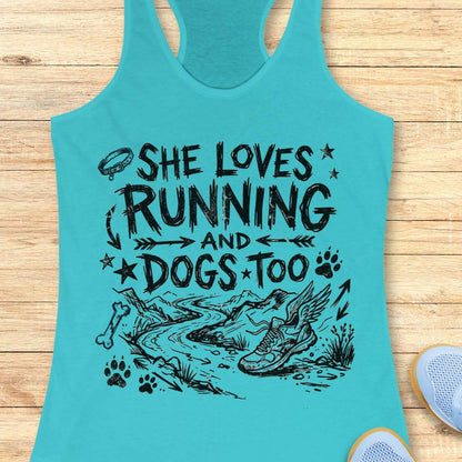 Turquoise tank top with black graphic and text 'She loves running and dogs too' on a wooden surface.