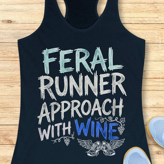navy tank top with black graphic design and text 'feral runner approach with wine', on a wooden surface