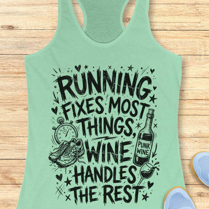 mint tank top with black graphic design and text 'running fixes most things, wine handles the rest', on a wooden surface