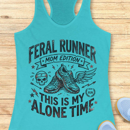 blue tank top with black graphic design and text 'feral runner, mom edition. This is my alone time', on a wooden surface