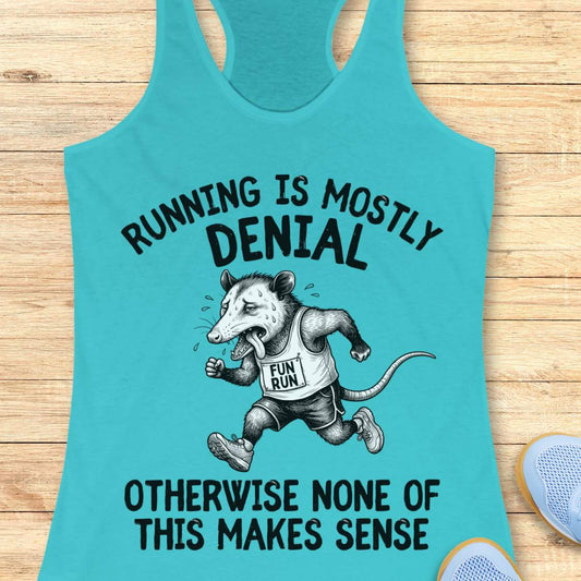 blue tank top with black graphic design and text 'running is mostly denial. otherwise, none of this makes sense.', on a wooden surface