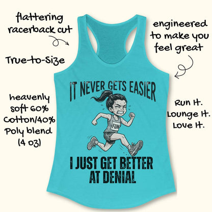 blue tank top with black graphic design and text 'it never gets easier, I just get better at denial', on a white surface