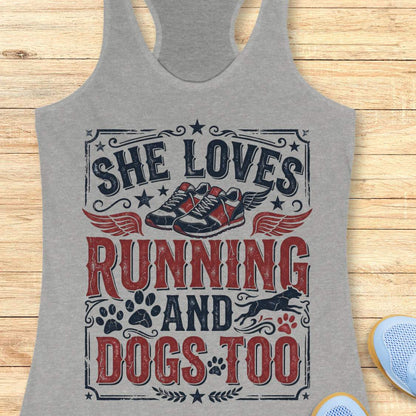 grey tank top with graphic design and text 'She loves running and dogs too.', on a wooden surface