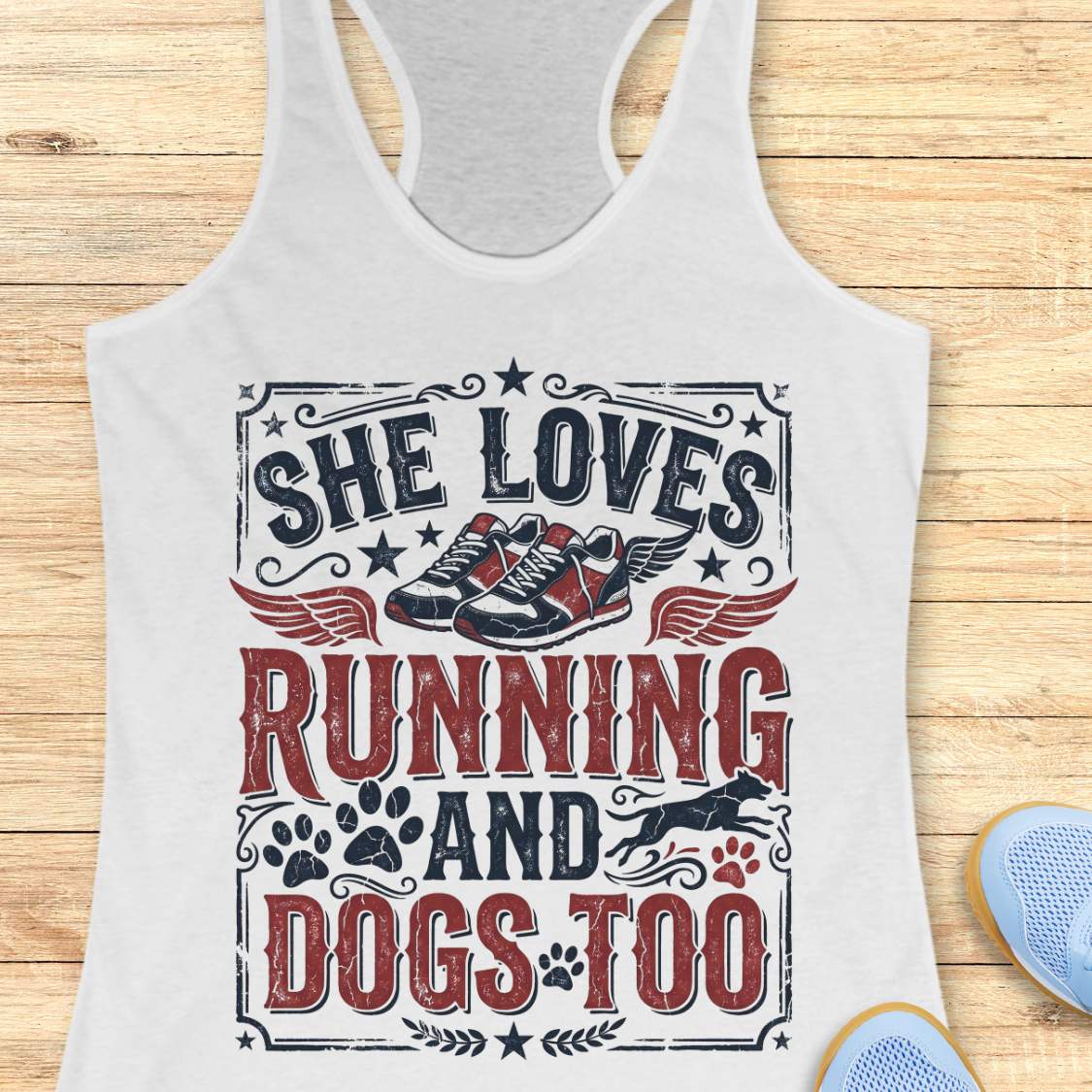 white tank top with graphic design and text 'She loves running and dogs too.', on a wooden surface