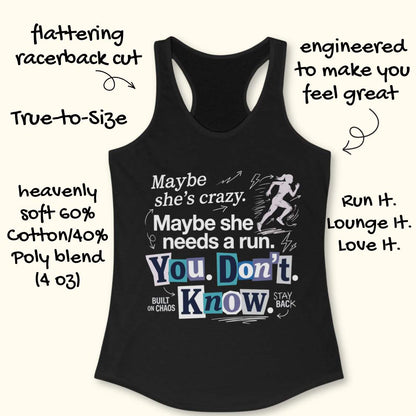 black tank top with graphic design and text 'Maybe she's crazy. Maybe she needs a run. You. Don't. Know.', on a wooden surface
