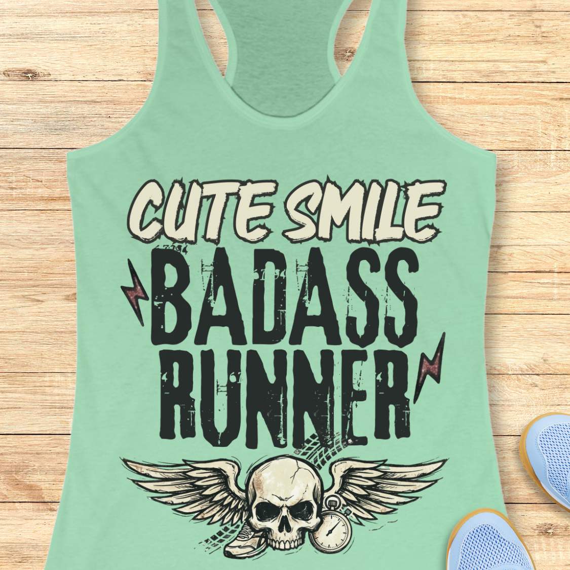 mint tank top with text 'cute smile badass runner, on a wooden surface