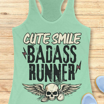 mint tank top with text 'cute smile badass runner, on a wooden surface