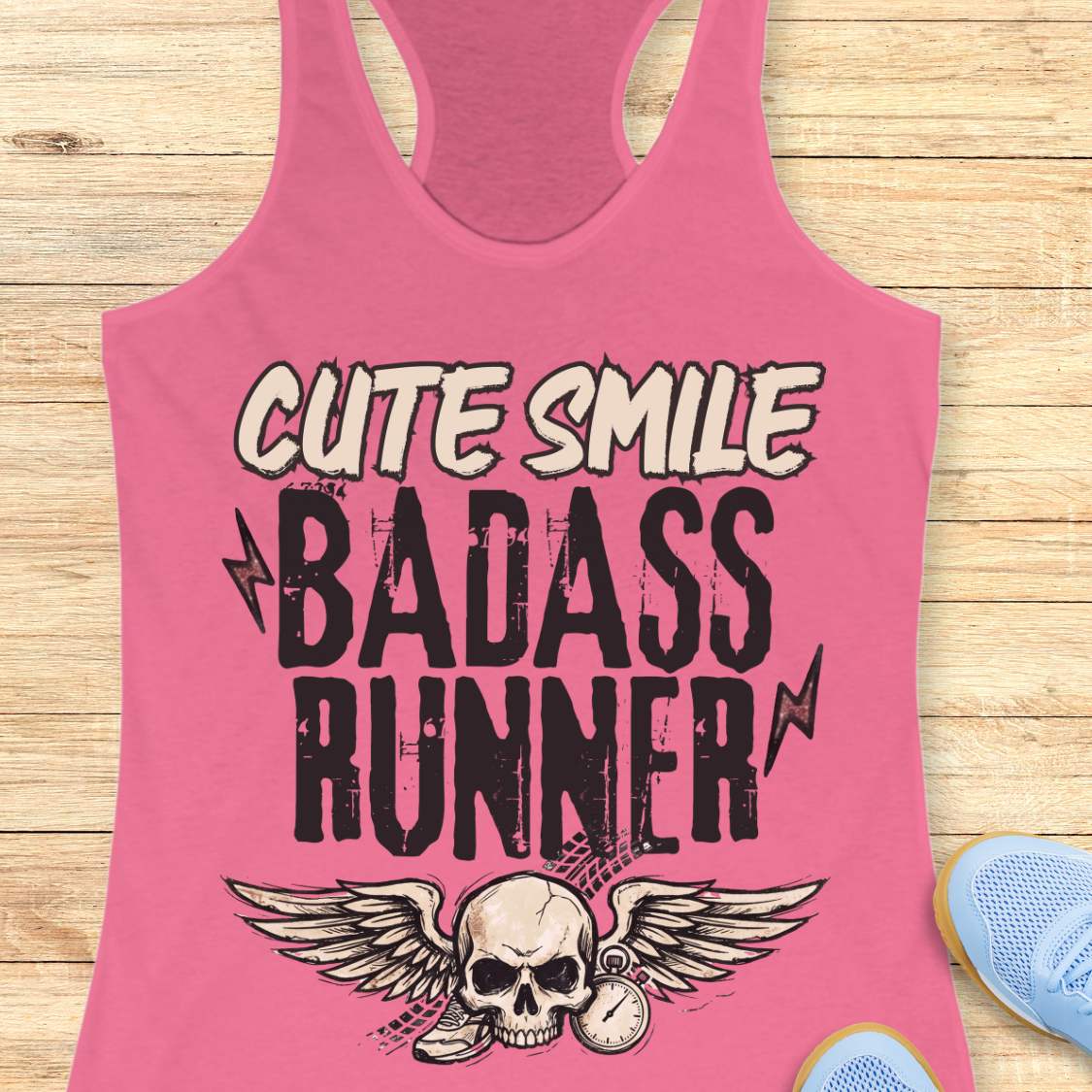 pink tank top with text 'cute smile badass runner, on a wooden surface