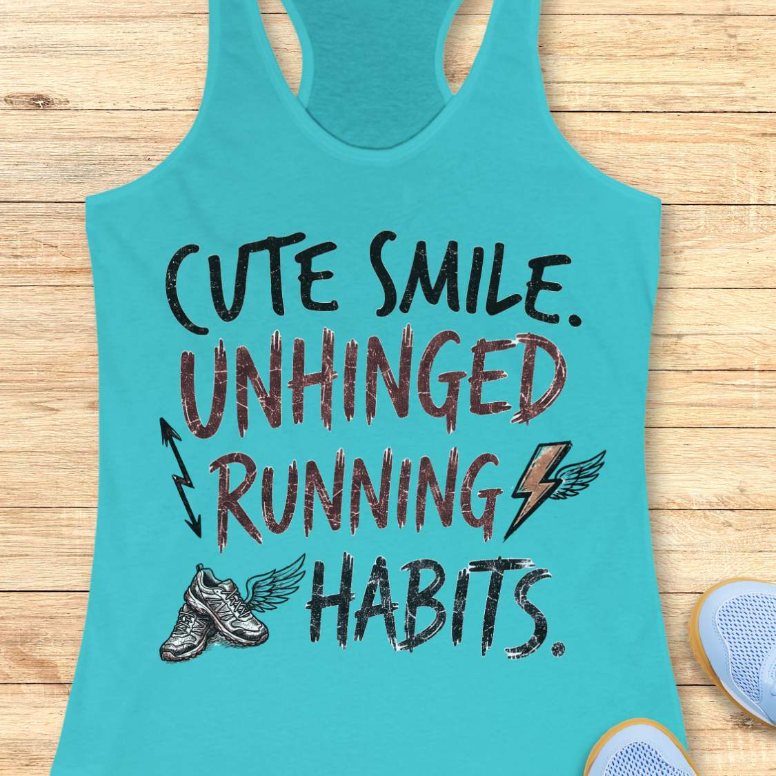 blue tank top with text 'cute smile unhinged running habits', on a wooden surface