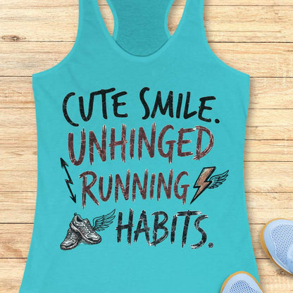 blue tank top with text 'cute smile unhinged running habits', on a wooden surface