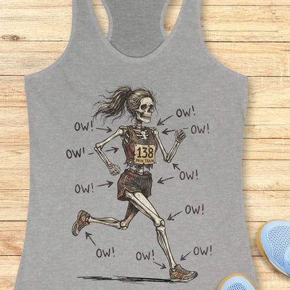 grey tank top with a running skeleton, on a wooden surface