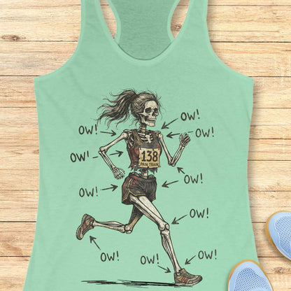mint tank top with a running skeleton, on a wooden surface