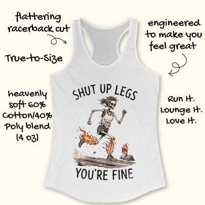 A white racerback tank top laid flat on a light wood background, featuring a humorous running skeleton graphic with the text 'Shut up legs you're fine'.