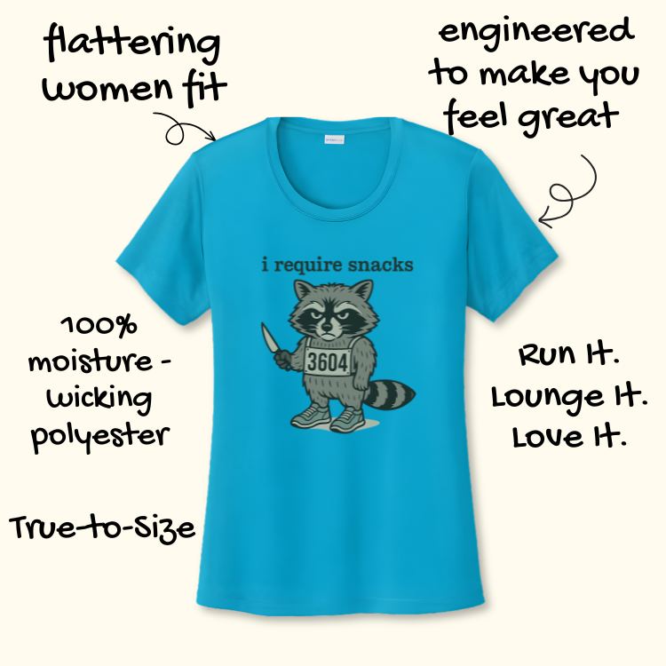 A turquoise blue women's moisture-wicking t-shirt featuring a graphic of a cartoon raccoon holding a knife, wearing a "3604" race bib, and the text "i require snacks"