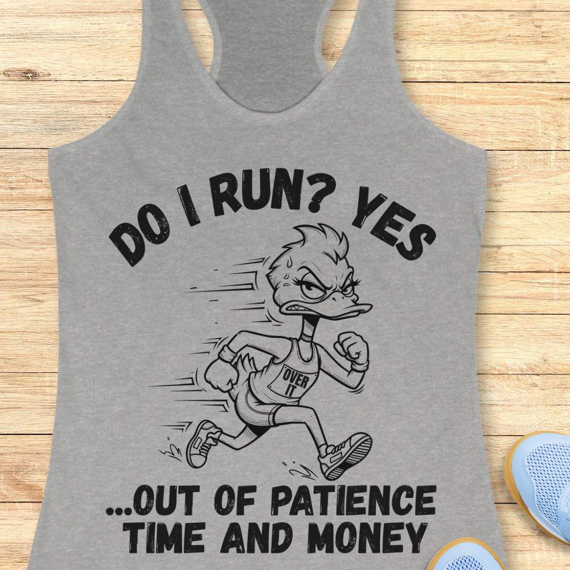 A heather gray racerback tank top featuring a black graphic of a running duck wearing a 'OVER 12' shirt, with the text 'DO I RUN? YES .