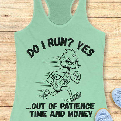 A mint green racerback tank top laid flat on a light wood background, featuring a black graphic of a cartoon duck running with the text 'DO I RUN? YES .