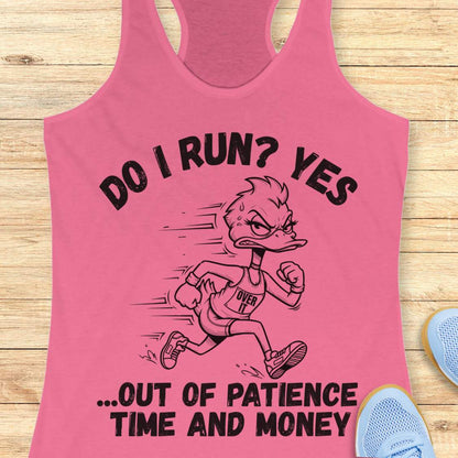 A pink racerback tank top laid flat on a light wood surface, featuring a black graphic of a running duck with the text 'DO I RUN? YES .