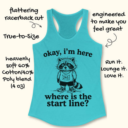 A turquoise racerback tank top with a black graphic of a raccoon wearing a race bib and the text 'okay, i'm here where is the start line?'. Handwritten marketing text surrounds the shirt on a light cream background.