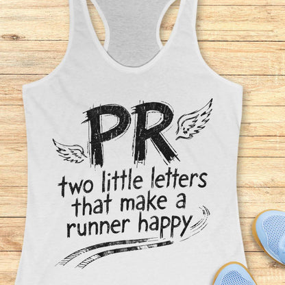 A white racerback tank top with a black graphic print reading 'PR two little letters that make a runner happy' with wing illustrations, shown on a light wood background with partial blue shoes visible at the edges.