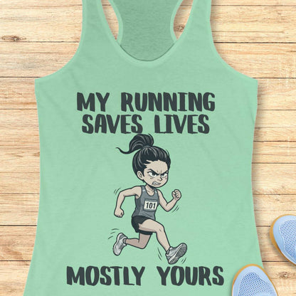 A mint green racerback tank top laid flat on a light wood background, featuring a cartoon illustration of a running woman and the text 'MY RUNNING SAVES LIVES MOSTLY YOURS'.