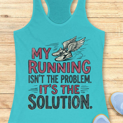 A turquoise racerback tank top laid flat on a light wood background, featuring a graphic of winged running shoes and the text 'MY RUNNING ISN'T THE PROBLEM. IT'S THE SOLUTION.