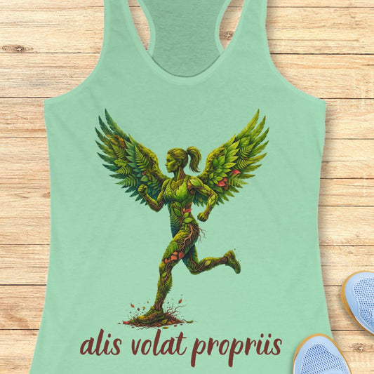 A mint green racerback tank top featuring a graphic of a winged female figure made of green leaves and vines, with the text 'alis volat propriis' printed below in dark red. The tank top is displayed flat on a light wood background.