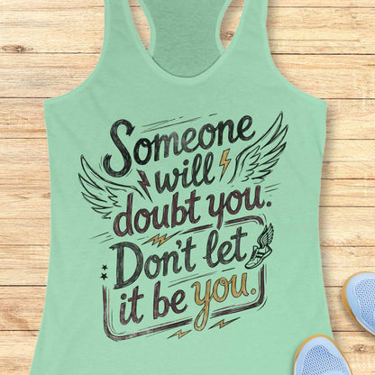 A mint green racerback tank top with a motivational graphic reading 'Someone will doubt you. Don't let it be you.