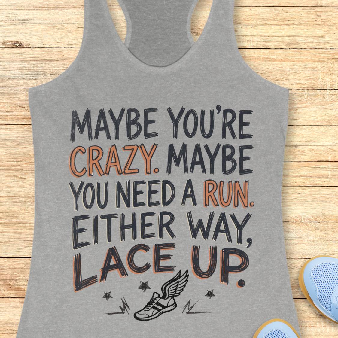 A heather gray racerback tank top with a motivational graphic reading 'MAYBE YOU'RE CRAZY. MAYBE YOU NEED A RUN.