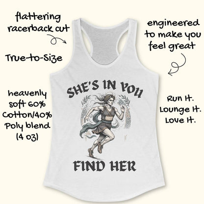 A white racerback tank top featuring a graphic of a running woman with the text 'SHE'S IN YOU FIND HER' printed on the front, displayed flat on a light wood background.