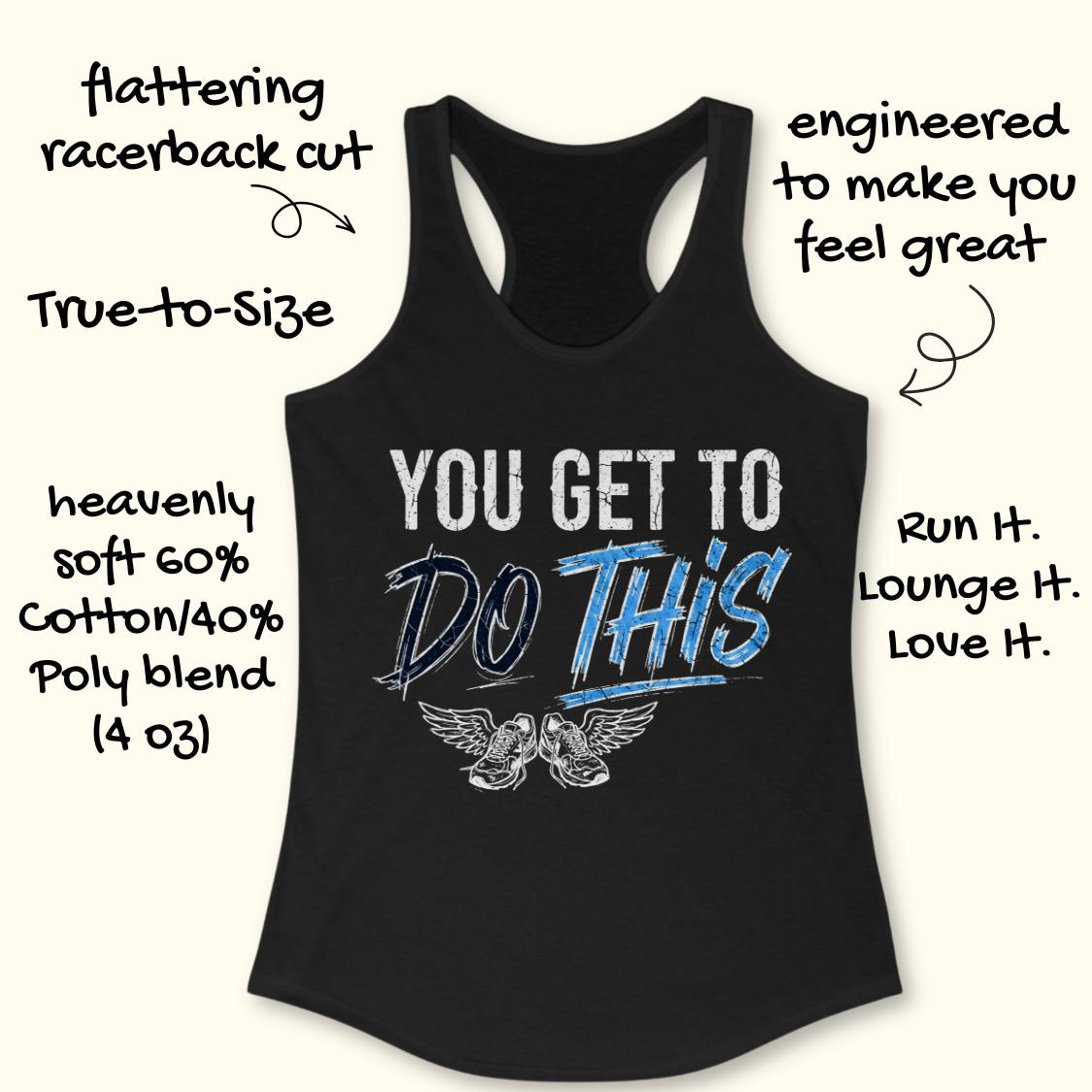 A black racerback tank top laid flat on a light wood background, featuring a graphic print that reads 'YOU GET TO DO THIS' with a pair of winged sneakers underneath.