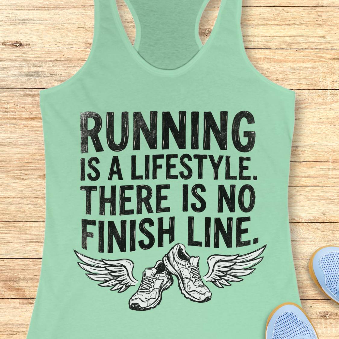A mint racerback tank top with a black graphic print that reads 'RUNNING IS A LIFESTYLE. THERE IS NO FINISH LINE.