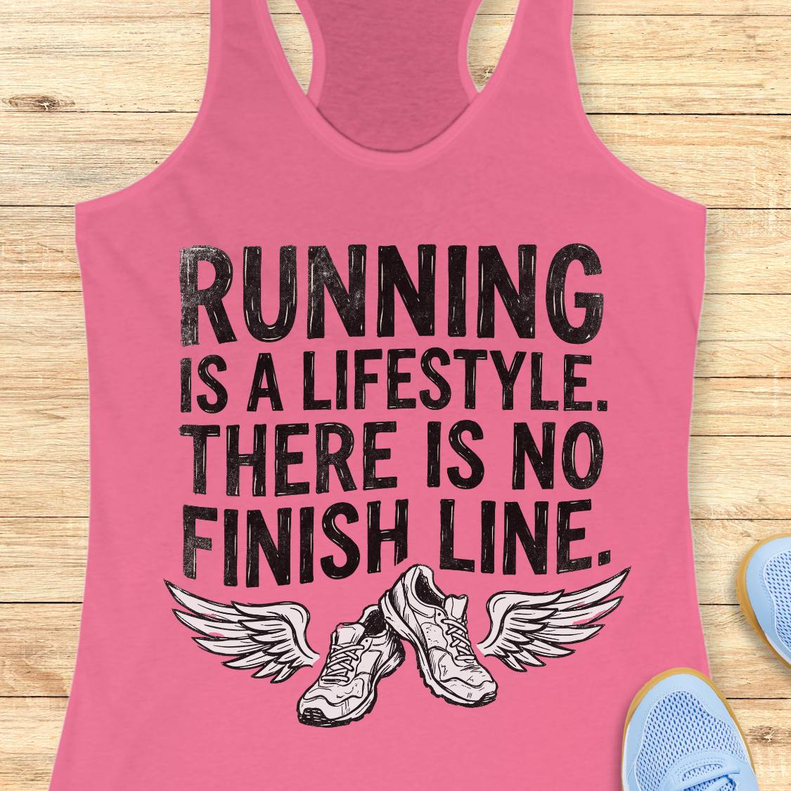 A pink racerback tank top with a black graphic print that reads 'RUNNING IS A LIFESTYLE. THERE IS NO FINISH LINE.