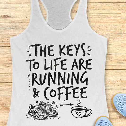 A white racerback tank top with a black graphic print that reads 'THE KEYS TO LIFE ARE RUNNING & COFFEE' with running shoes and a coffee cup illustration, shown on a wooden background.