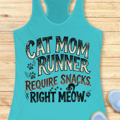 A turquoise racerback tank top laid flat on a light wood surface, featuring the text 'CAT MOM RUNNER REQUIRE SNACKS RIGHT MEOW' with paw prints and a small cat graphic. Part of a light blue shoe is visible at the bottom right.