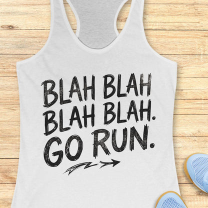 A white racerback tank top with black distressed text reading 'BLAH BLAH BLAH. GO RUN.