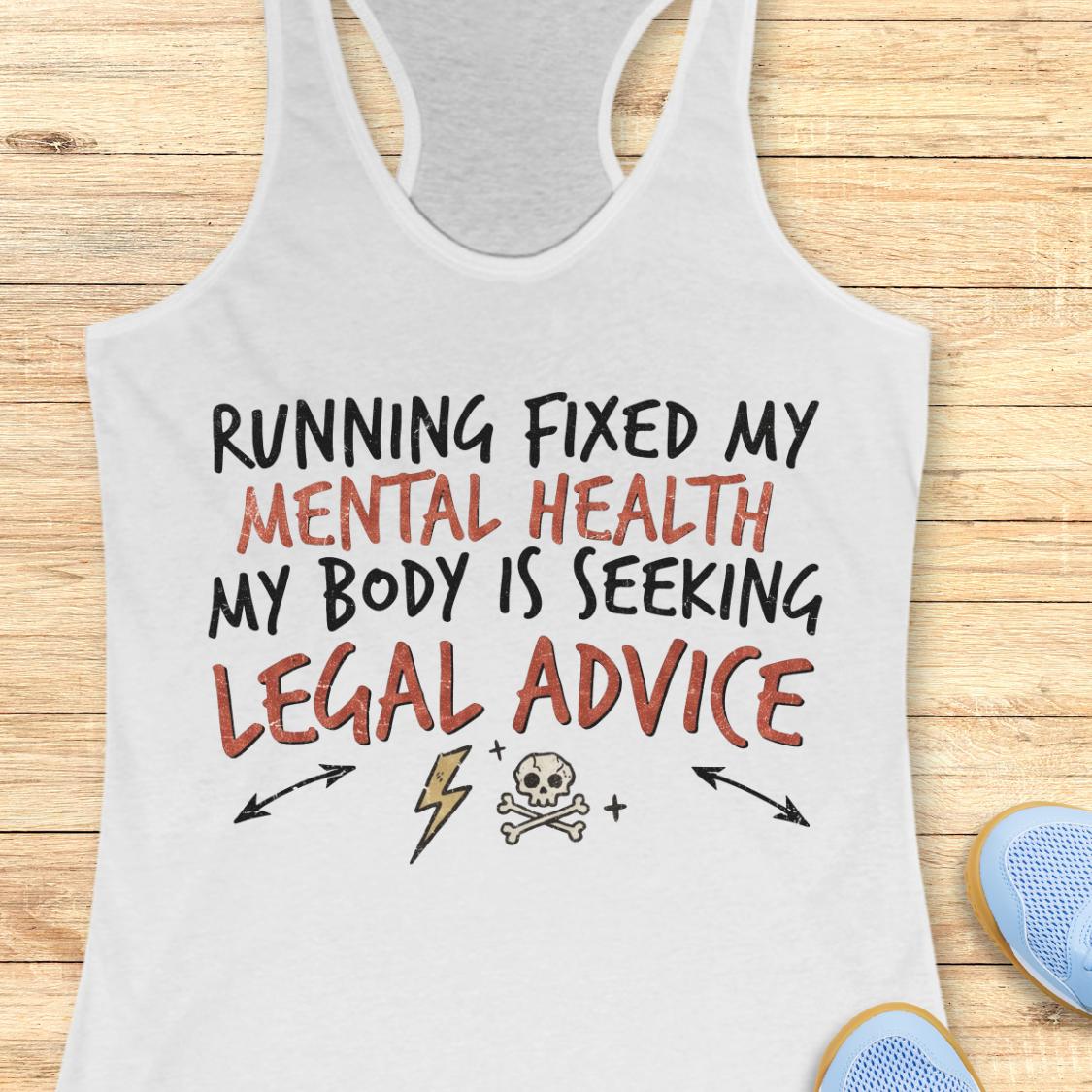 A white racerback tank top with a humorous graphic print reading 'RUNNING FIXED MY MENTAL HEALTH MY BODY IS SEEKING LEGAL ADVICE' in black and reddish-brown lettering, displayed flat on a light wood background with partial blue sneakers visible at the bottom right.