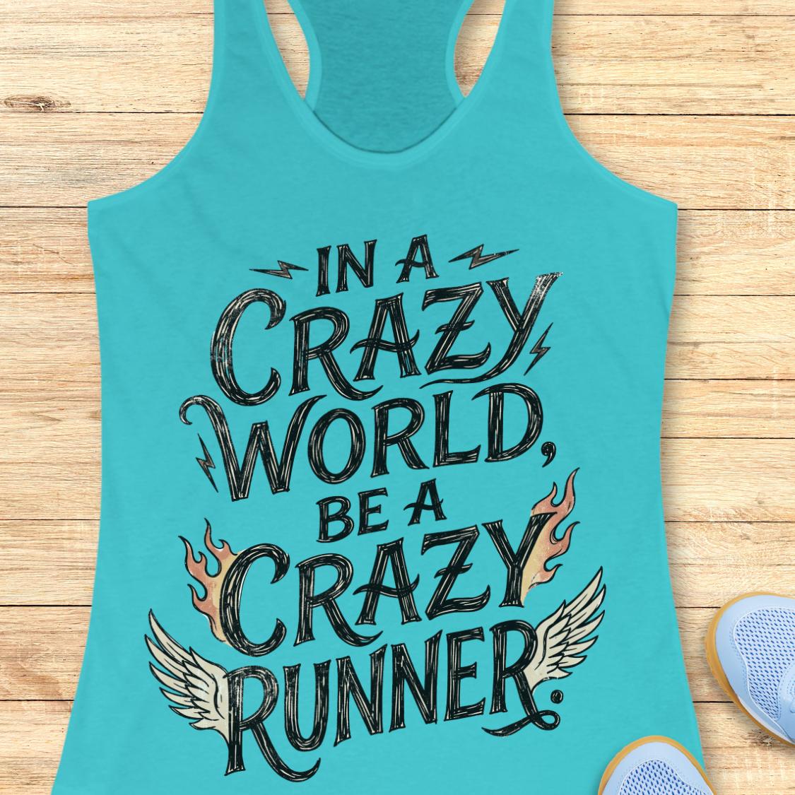A turquoise racerback tank top laid flat on a light wood surface, featuring the phrase 'IN A CRAZY WORLD, BE A CRAZY RUNNER' in large black lettering with flame and wing graphics. Part of a light blue shoe is visible at the bottom right.