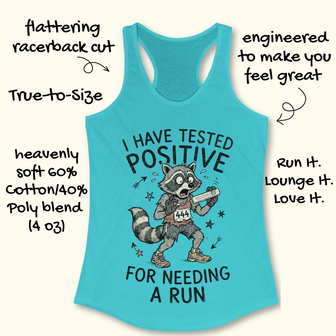 A turquoise racerback tank top with a cartoon raccoon graphic and the text 'I HAVE TESTED POSITIVE FOR NEEDING A RUN' on a light beige background, surrounded by promotional handwritten-style callouts.