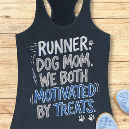 A racerback tank top in dark navy blue, laid flat on a light wood background. The tank top features a graphic print that reads 'RUNNER.