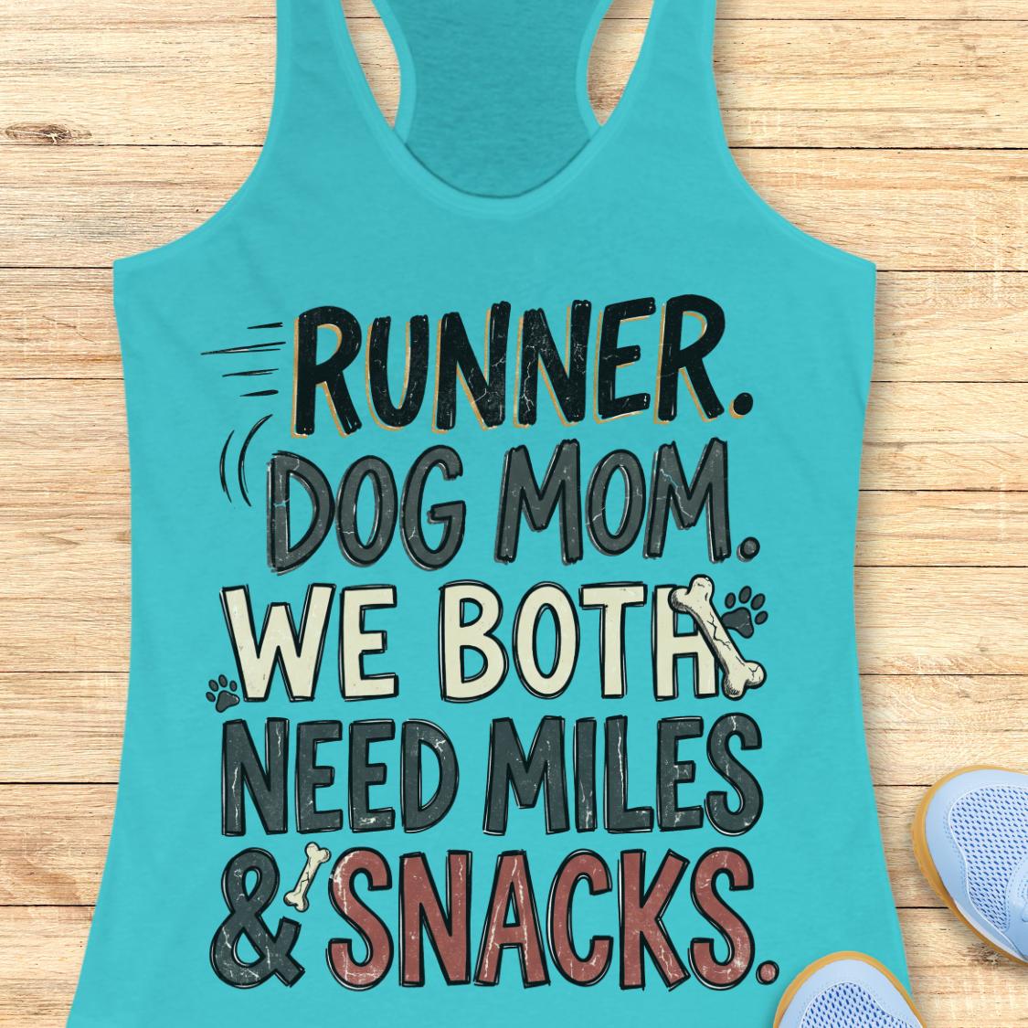 A turquoise racerback tank top laid flat on a light wood background, featuring the text 'RUNNER. DOG MOM.