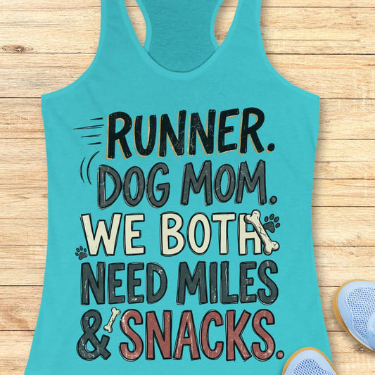 A turquoise racerback tank top laid flat on a light wood background, featuring the text 'RUNNER. DOG MOM.