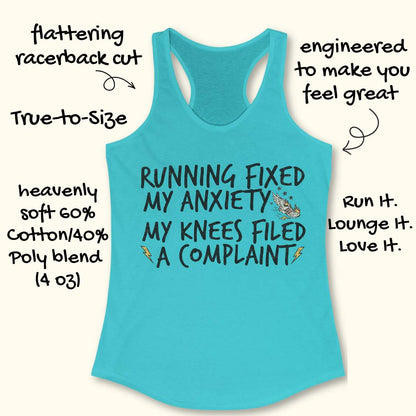 A turquoise racerback tank top laid flat on a light cream background, with handwritten callout text around it describing the fit and slogan. The tank top has a large printed message reading 'RUNNING FIXED MY ANXIETY MY KNEES FILED A COMPLAINT' with small lightning-bolt and spider graphics.