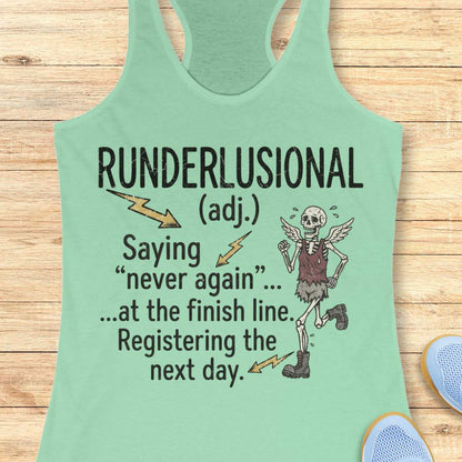 A mint green racerback tank top laid flat on a light wood background, featuring a humorous graphic print that defines 'Runderlusional' as saying 'never again' at the finish line the next day, accompanied by a cartoon skeleton running figure and small blue shoes partially visible at the edges.