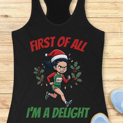 black running tank top featuring a cartoon holiday runner wearing a Santa hat and a race singlet labeled 'JOLLY.' The runner is surrounded by holly leaves and colorful Christmas lights. The design includes the phrase 'FIRST OF ALL I'M A DELIGHT.'