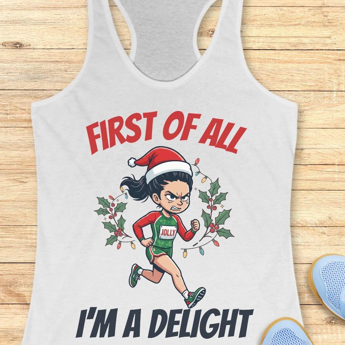 white running tank top featuring a cartoon holiday runner wearing a Santa hat and a race singlet labeled 'JOLLY.' The runner is surrounded by holly leaves and colorful Christmas lights. The design includes the phrase 'FIRST OF ALL I'M A DELIGHT.'