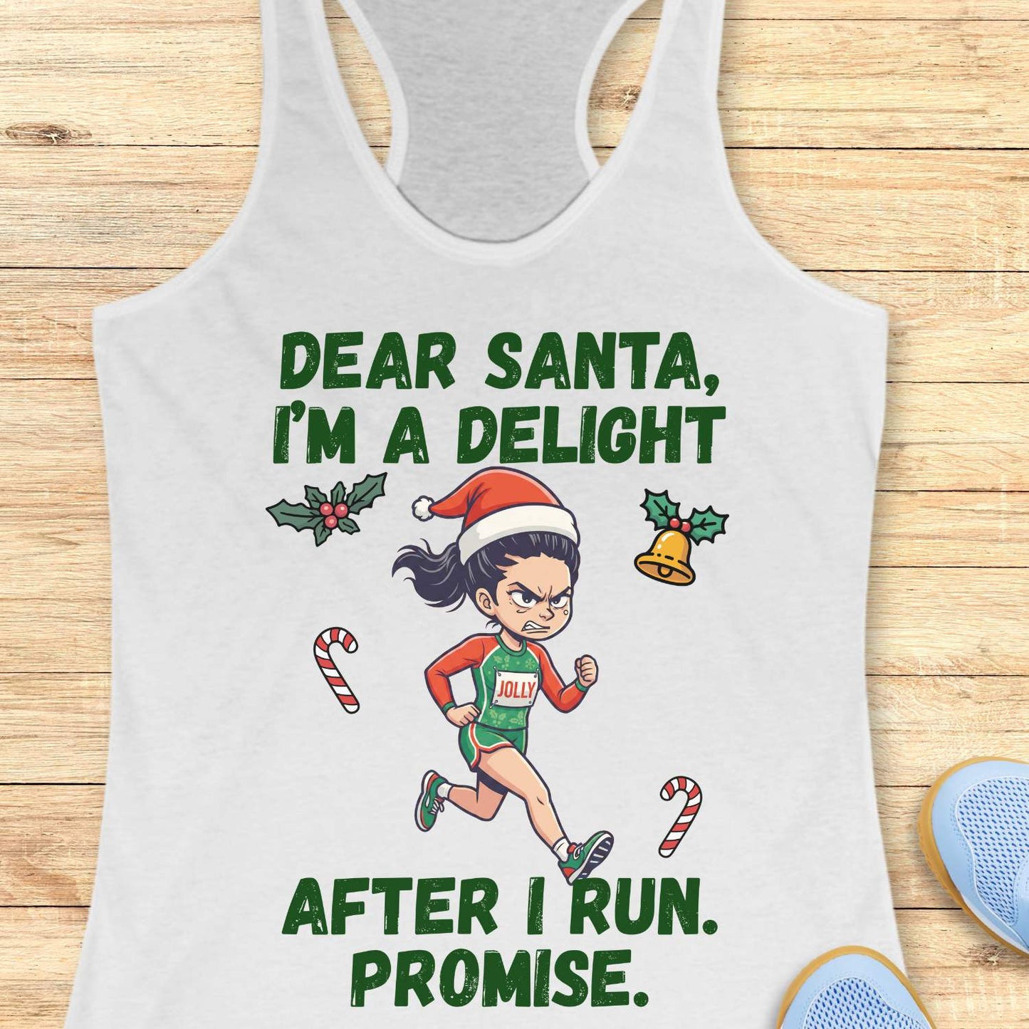 white racerback tank top displayed on a light wooden surface, featuring a festive running-themed graphic. The design shows a cartoon runner wearing a Santa hat, green running outfit with the word “JOLLY” on the chest, and running shoes. Holiday elements including holly leaves, a Christmas bell, and candy canes surround the runner. Bold green text above and below the illustration reads: “DEAR SANTA, I’M A DELIGHT” and “AFTER I RUN. PROMISE.” Partial blue athletic shoes are visible in the lower corner